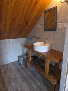 a bathroom with a sink on a wooden table at La mare aux canards in Châteauvieux +10 photos