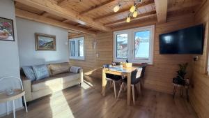 a living room with a couch and a table at Bergquelle 1.OG Ost in Bettmeralp