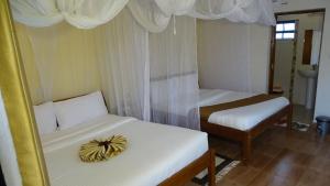 Giường trong phòng chung tại Storms Resort & Campsite