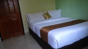 Giường trong phòng chung tại Storms Resort & Campsite +21 ảnh