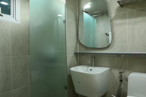 a bathroom with a sink and a mirror at Two Rest Pension in Damyang +19 photos