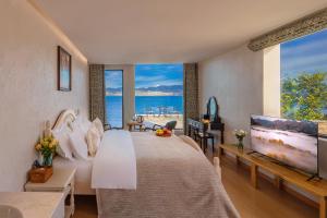 Postel nebo postele na pokoji v ubytování Blue Sea Hotel