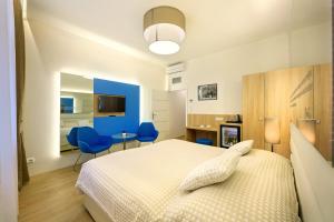 Posteľ alebo postele v izbe v ubytovaní Salvator Boutique Hotel vegan-friendly