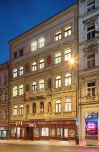 a large building on the corner of a street at Salvator Boutique Hotel vegan-friendly in Prague