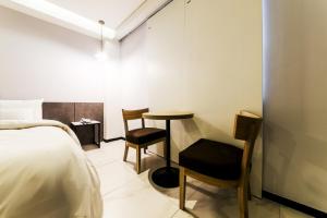 Postel nebo postele na pokoji v ubytování Hotel Cacao