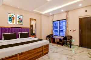 En eller flere senge i et værelse på Townhouse Mandarmani Beach Formerly Tropicana Beach Resort