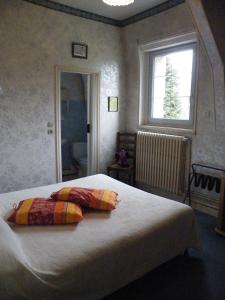 Ένα ή περισσότερα κρεβάτια σε δωμάτιο στο La Renaudière