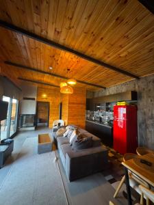 a living room with a couch and a red refrigerator at Palmera suit in Sapanca