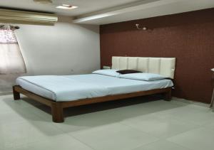 a bedroom with a large bed in a room at Geetha Residency in Anantapur