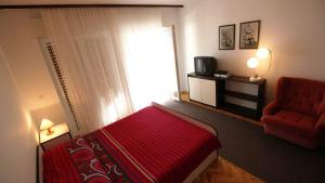 Posteľ alebo postele v izbe v ubytovaní Apartments Ivka