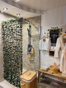 a bathroom with a shower and a sink at Ô Dream Spa in Le Val