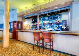a bar with two stools in front of it at Comfort Inn Birmingham in Birmingham