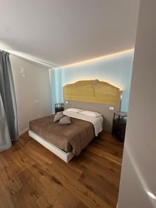 En eller flere senge i et værelse på Quattro Vette