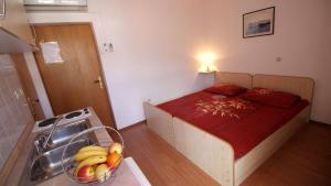 Posteľ alebo postele v izbe v ubytovaní Apartments Ivka