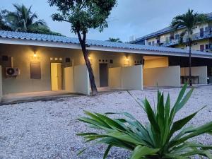 a house with a courtyard in front of it at D Love Gueshouse in Ranong