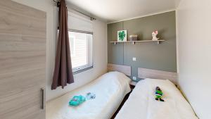Postel nebo postele na pokoji v ubytování Mobil-home confort 6 personnes