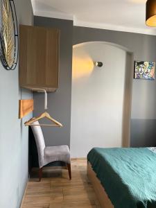 En eller flere senge i et værelse på Centrum Kupiecka Apartment