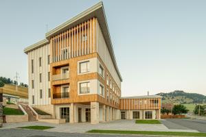 an external view of a building at Skigyimes Hotel in Lunca de Sus