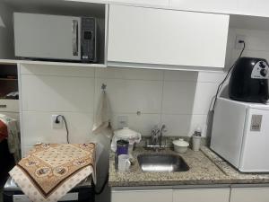 Køkken eller tekøkken på Condomínio da Fe Canção Nova