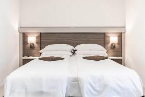 En eller flere senge i et værelse på Benini Holidays: Villa San Pietro