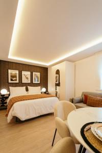 En eller flere senge i et værelse på Fuente H3 + 14 billeder