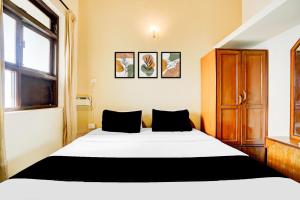 Postel nebo postele na pokoji v ubytování Super Townhouse Calangute Formerly Hotel Horizon + 54 fotografií