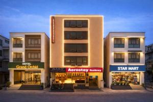 a building with shops in front of it at Hotel Aerostay International Airport Delhi in New Delhi