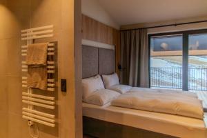 En eller flere senge i et værelse på Aurum