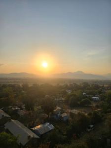 a view of the sun setting over a city at `Saala Hotel Limited in Isiolo