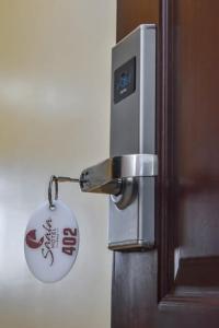 a door with a key chain attached to it at `Saala Hotel Limited in Isiolo