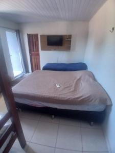 En eller flere senge i et værelse på Pousadas JC 5