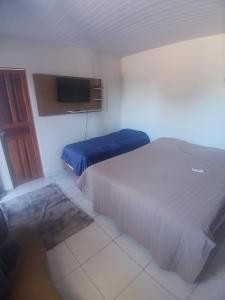 En eller flere senge i et værelse på Pousadas JC 5