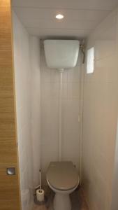 a small bathroom with a toilet in a room at Studio meublé Centre ville in Bastia +2 photos