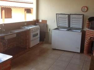 Køkken eller tekøkken på Quarto chácara + 8 billeder