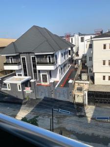 a group of houses in a street with buildings at Boho apartment and spa in Lekki