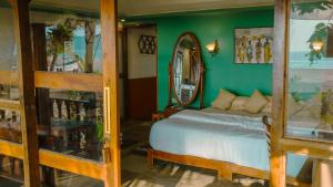 Postel nebo postele na pokoji v ubytování Mariposa Beach Grove