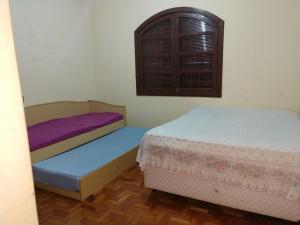 En eller flere senge i et værelse på Quarto chácara