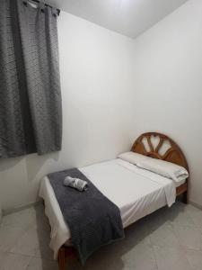 En eller flere senge i et værelse på Casa Vacacional Bien Ubicada San Gil Santander + 6 billeder