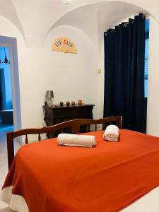 Giường trong phòng chung tại Chez Arlette