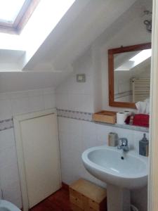 a bathroom with a sink and a mirror at bed and breakfast La Terrazza in Genoa +64 photos