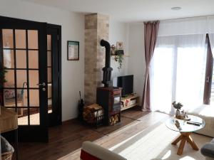 a living room with a wood stove in it at Durmitor Sunstone in Žabljak