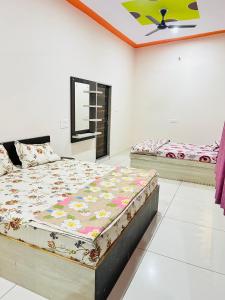 a bedroom with two beds in a room at New hotel Arjun place, Reengus in Rīngas