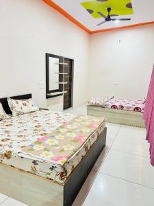 a bedroom with two beds in a room at New hotel Arjun place, Reengus in Rīngas