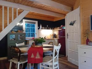a kitchen with a table and chairs in a room at Black&White-Cherry in Kołczewo +30 photos
