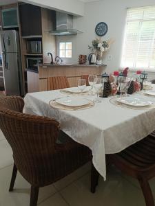 a dining room table with wine glasses on it at Doce aconchego in Pato Branco