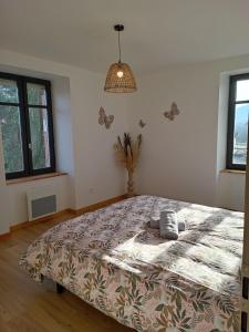 Postel nebo postele na pokoji v ubytování Au bien-hêtre + 2 fotografie