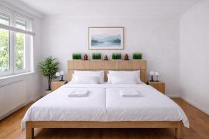 En eller flere senge i et værelse på Comfort 28 Parkside Comfort