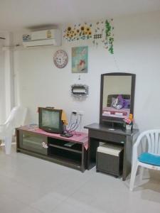 a room with a desk with a mirror and a tv at We Love Kata in Kata Beach +98 photos