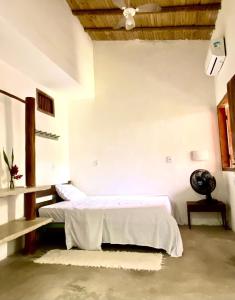 En eller flere senge i et værelse på Casa de Kati