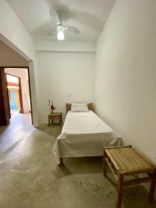 En eller flere senge i et værelse på Casa de Kati